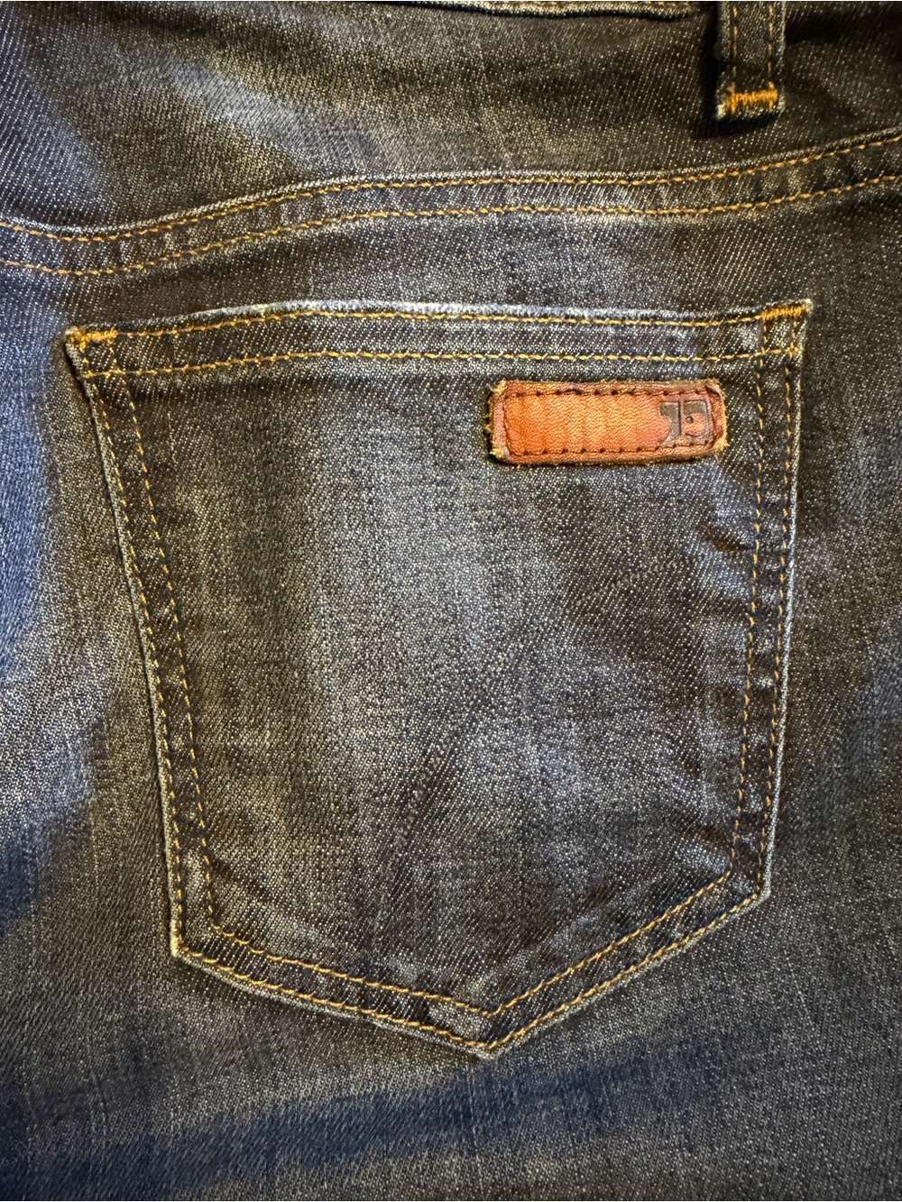 Dark Blue Denim Joe’s Jeans with Contrast Stitching and cuffed hem.  Size 26